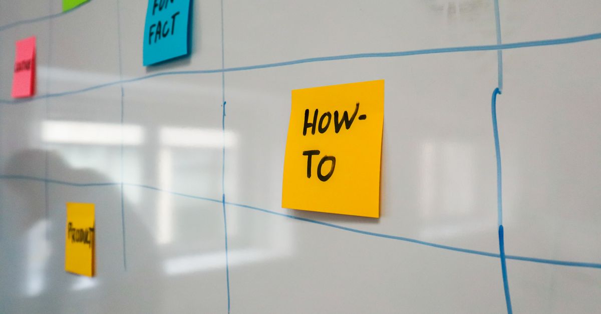 Organized whiteboard with colorful sticky notes used for planning and brainstorming.